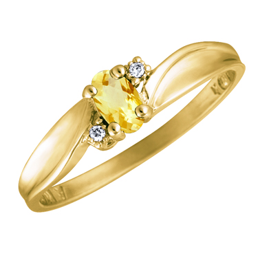 Genuine Citrine 5x3 oval (November birthstone) set in 10kt yellow gold ring with 2 accent diamond...