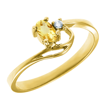 Genuine Citrine 5x3 oval (November birthstone) set in 10kt yellow gold ring with .02ct round diam...