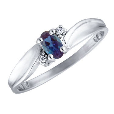 Created Alexandrite 5x3 oval (June birthstone) set in 10kt white gold ring with 2 accent diamonds...