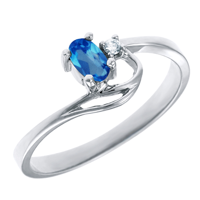 Genuine Blue Topaz 5x3 oval (December birthstone) set in 10kt white gold ring with .02ct round di...