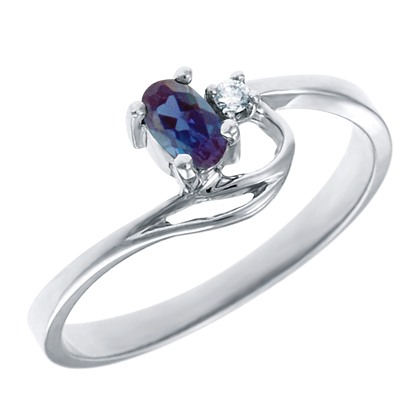 Created Alexandrite 5x3 oval (June birthstone) set in 10kt white gold ring with .02ct round diamo...