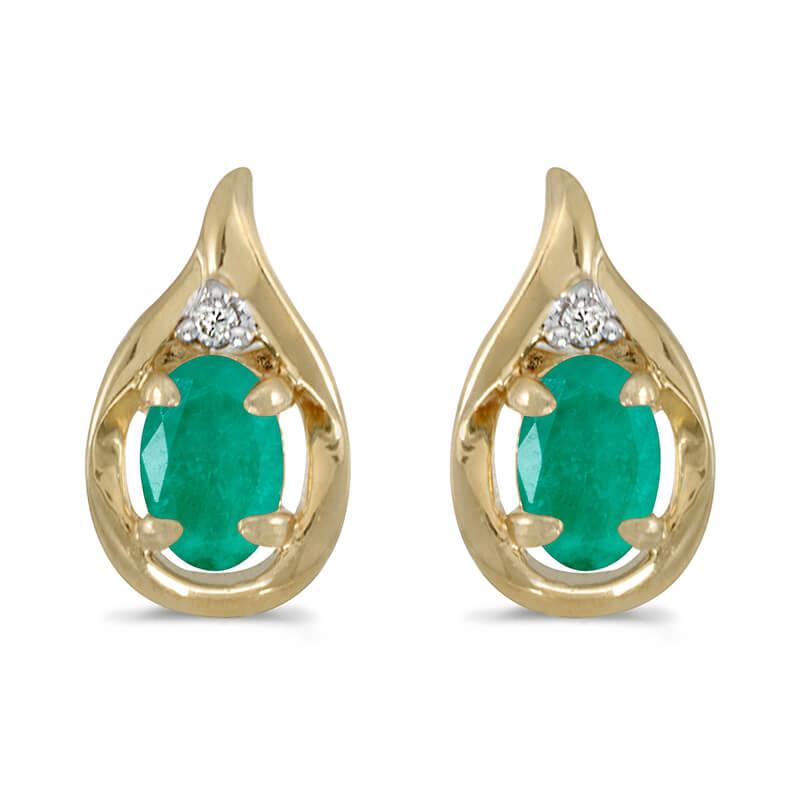 These 14k yellow gold oval emerald and diamond earrings feature 6x4 mm genuine natural emeralds w...
