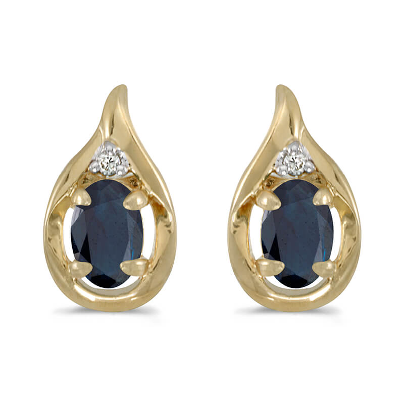 These 14k yellow gold oval sapphire and diamond earrings feature 6x4 mm genuine natural sapphires...