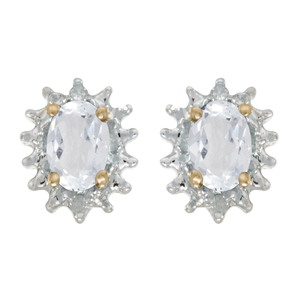 These 14k yellow gold oval white topaz and diamond earrings feature 6x4 mm genuine natural white topazs with a 0.96 ct total weight and .04 ct diamonds.