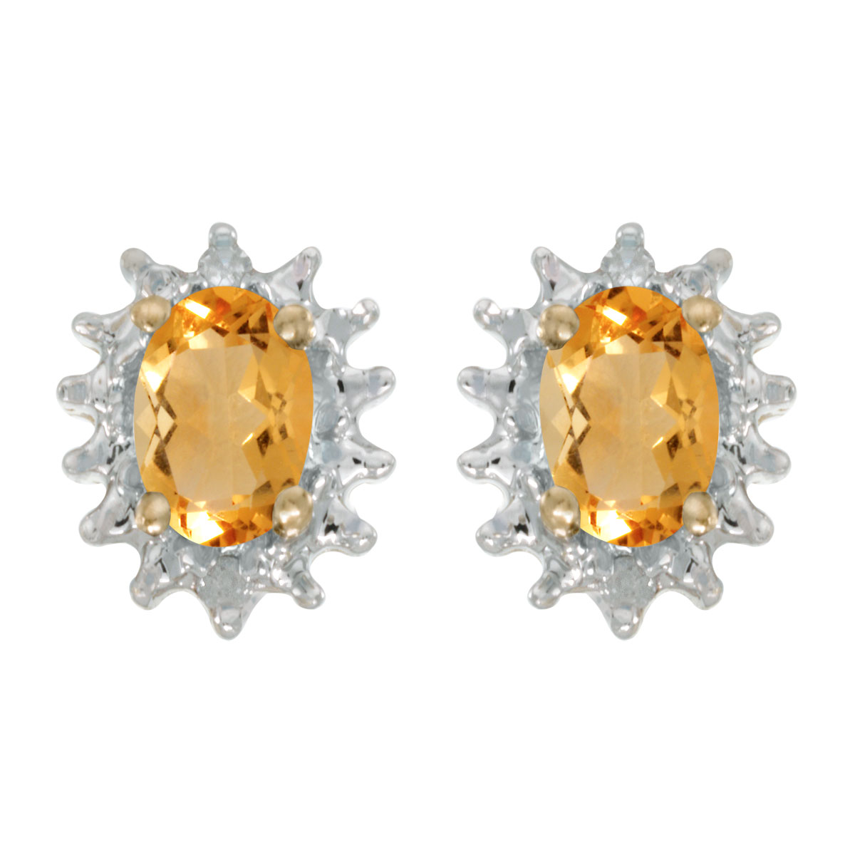 These 14k yellow gold oval citrine and diamond earrings feature 6x4 mm genuine natural citrines w...