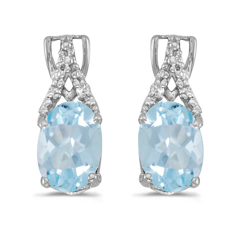 These 14k white gold oval aquamarine and diamond earrings feature 7x5 mm genuine natural aquamari...