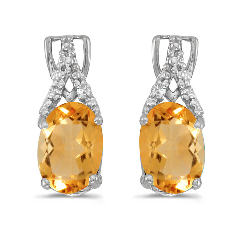 These 14k white gold oval citrine and diamond earrings feature 7x5 mm genuine natural citrines wi...