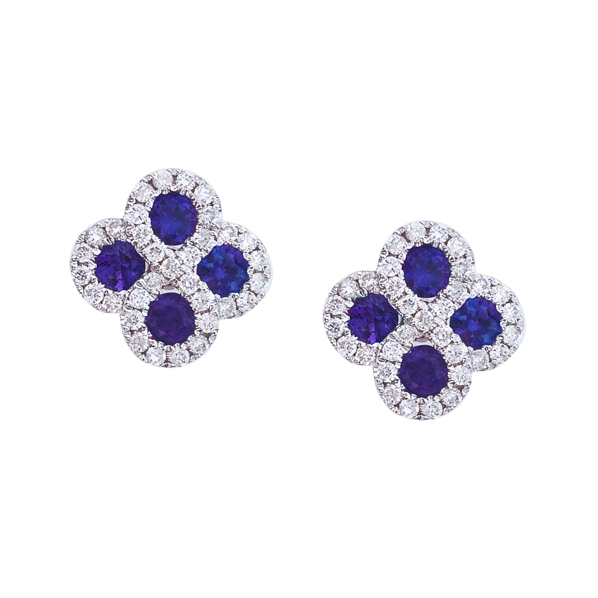 Beautiful clover shaped earrings with 2.7 mm sapphires surrounded by gleaming diamonds.