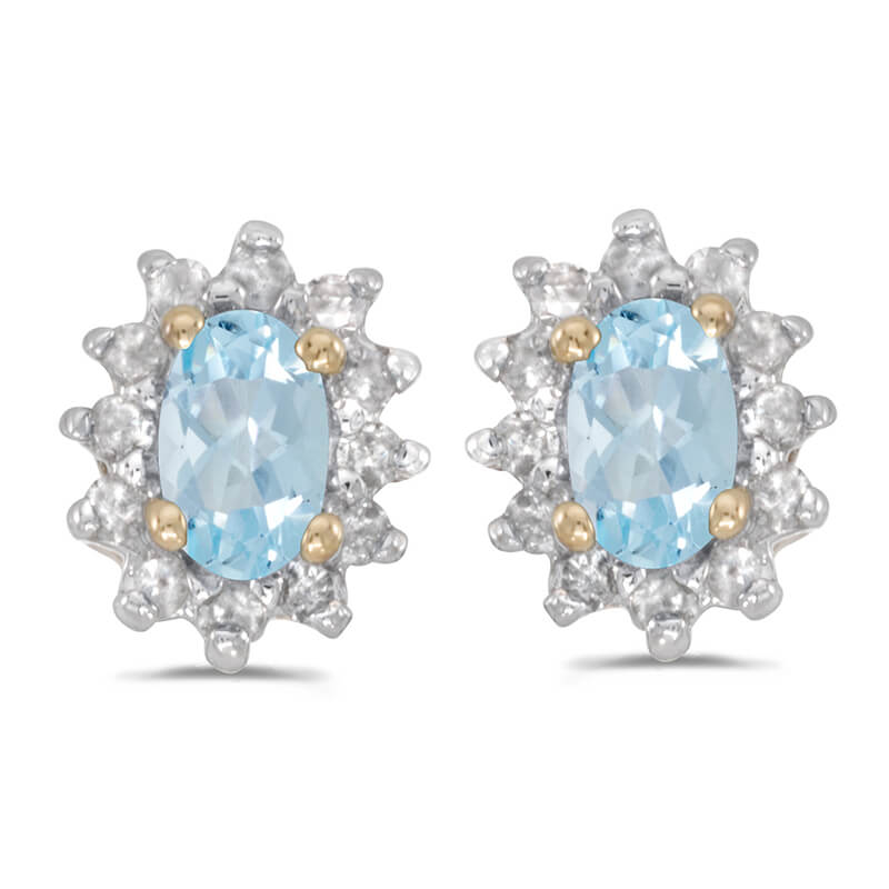 These 14k yellow gold oval aquamarine and .25 ct diamond earrings feature 5x3 mm genuine natural ...