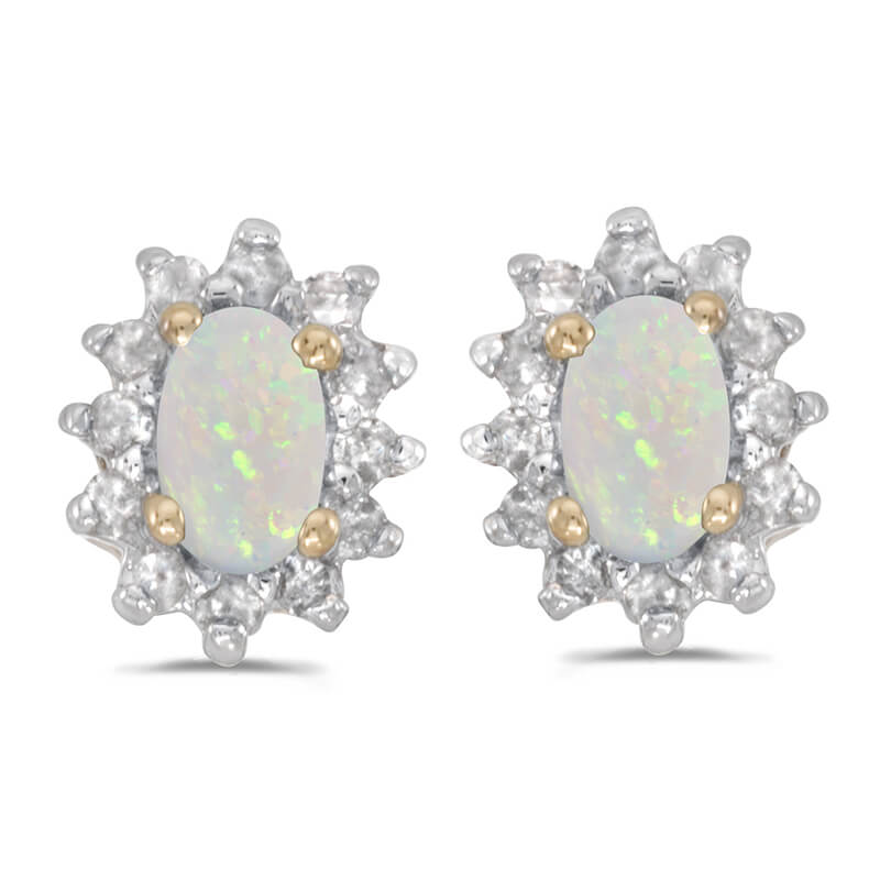These 14k yellow gold oval opal and .25 ct diamond earrings feature 5x3 mm genuine natural opals ...