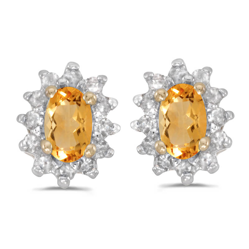 These 14k yellow gold oval citrine and .25 ct diamond earrings feature 5x3 mm genuine natural cit...