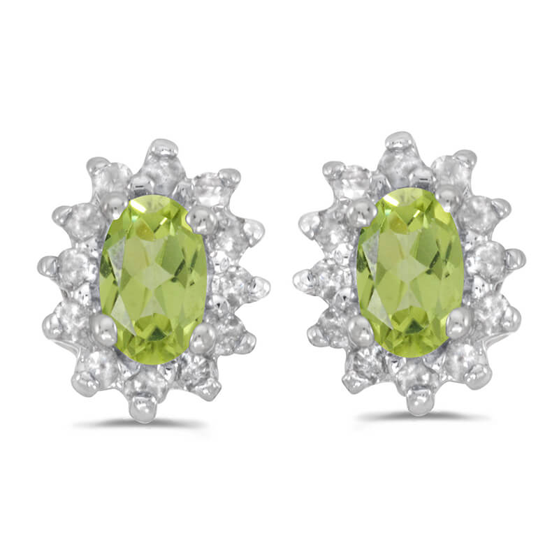 These 14k white gold oval peridot and .25 ct diamond earrings feature 5x3 mm genuine natural peri...