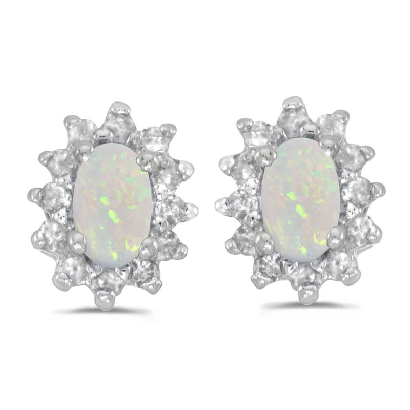 These 14k white gold oval opal and .25 ct diamond earrings feature 5x3 mm genuine natural opals w...