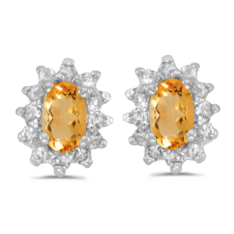These 14k white gold oval citrine and .25 ct diamond earrings feature 5x3 mm genuine natural citr...