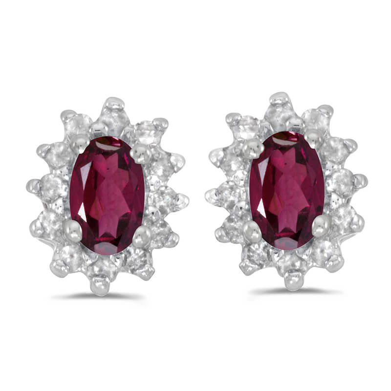 These 14k white gold oval rhodolite garnet and .25 ct diamond earrings feature 5x3 mm genuine nat...