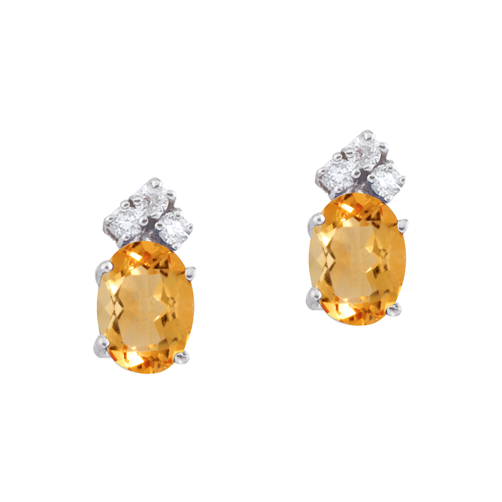 These 7x5 mm oval shaped citrine earrings are set in beautiful 14k white gold and feature .12 tot...