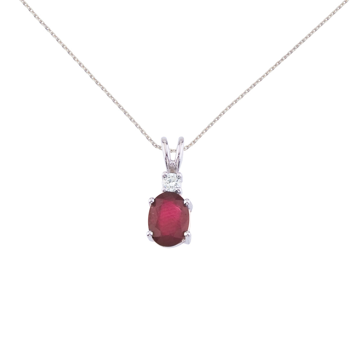 7x5 mm natural ruby and diamond pendant set in 14k white gold.