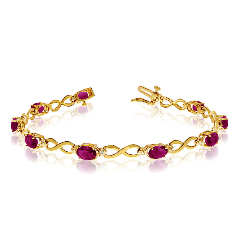 This 10k yellow gold oval ruby and diamond bracelet features nine 6x4 mm stunning natural rubys w...