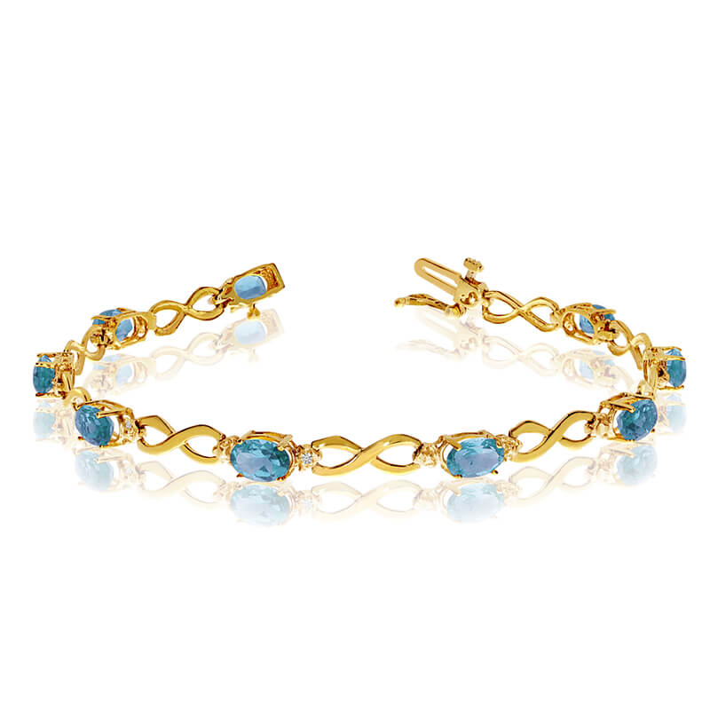 This 10k yellow gold oval blue topaz and diamond bracelet features nine 6x4 mm stunning natural blue topaz stones with a 3.60 ct total gem weight.