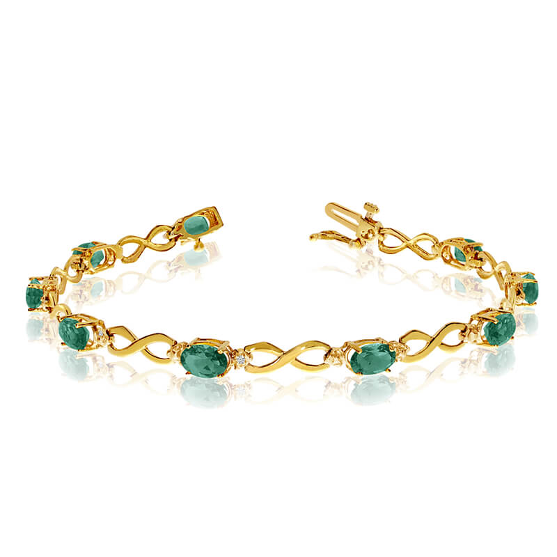 This 14k yellow gold oval emerald and diamond bracelet features nine 6x4 mm stunning natural emer...