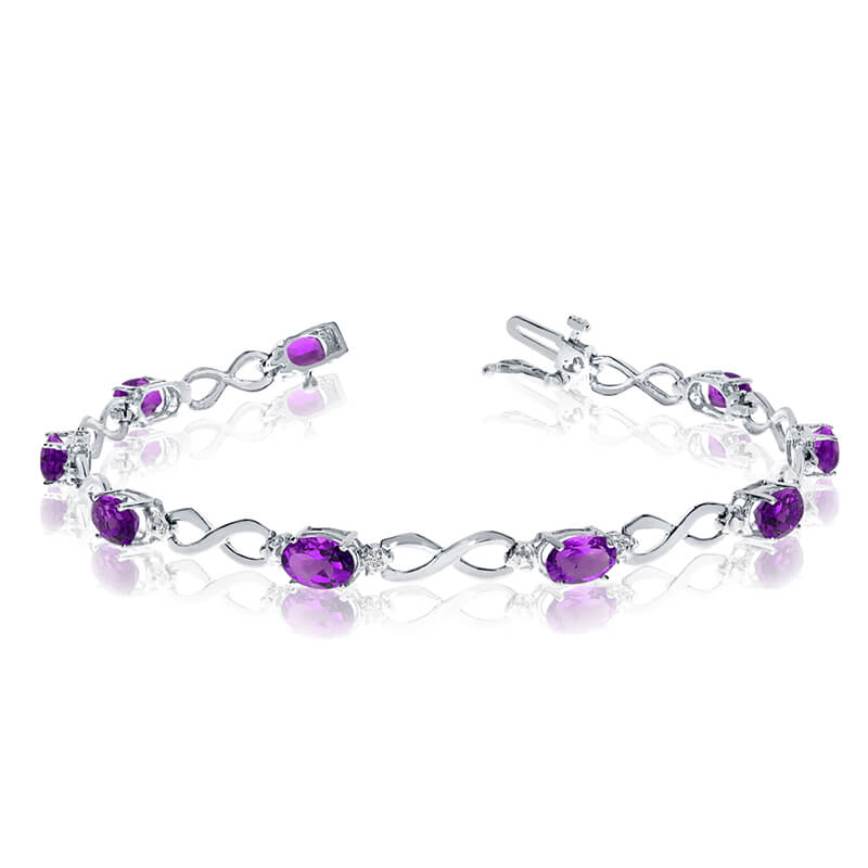 This 14k white gold oval amethyst and diamond bracelet features nine 6x4 mm stunning natural amet...