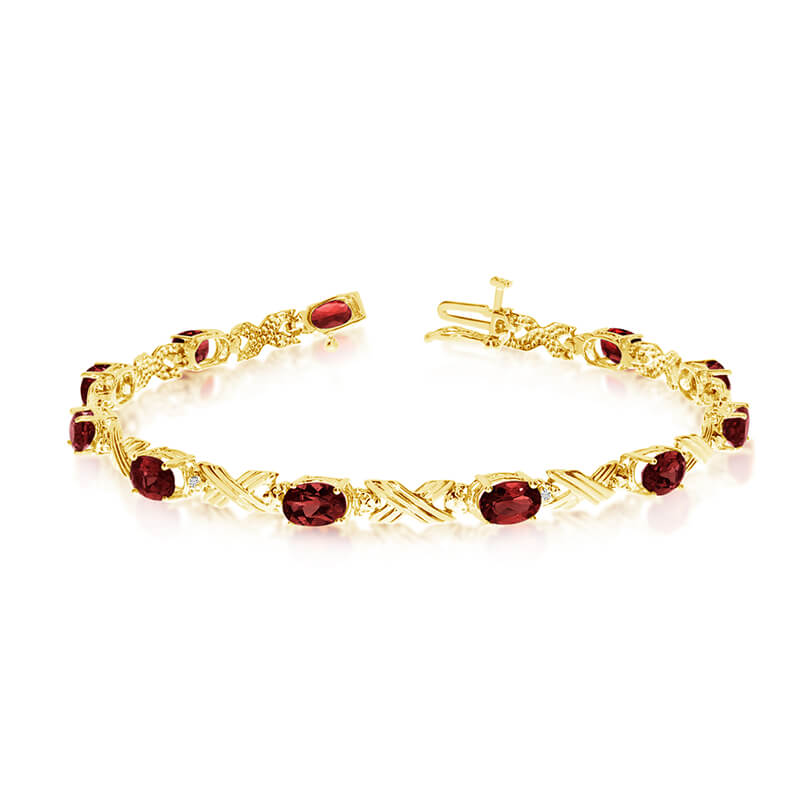 This 10k yellow gold oval garnet and diamond bracelet features eleven 6x4 mm stunning natural gar...