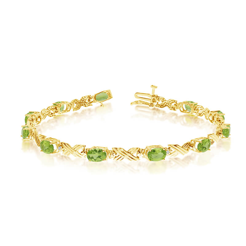This 10k yellow gold oval peridot and diamond bracelet features eleven 6x4 mm stunning natural pe...