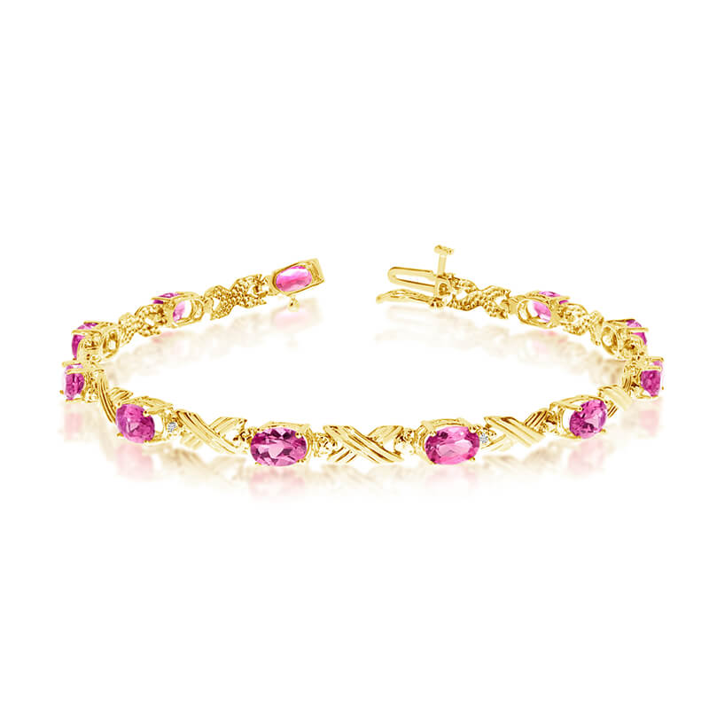 This 10k yellow gold oval pink topaz and diamond bracelet features eleven 6x4 mm stunning natural...