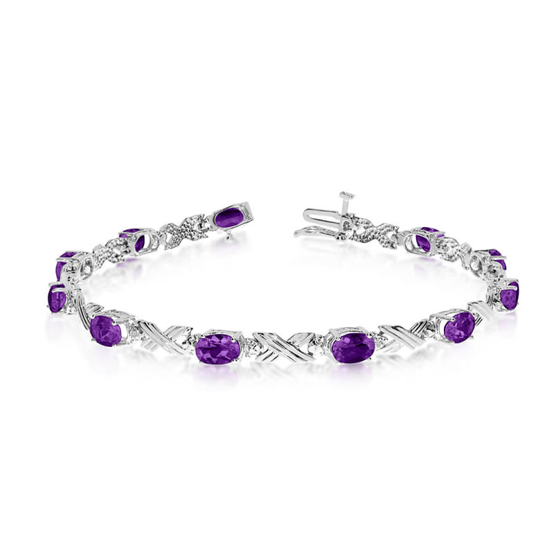 This 10k white gold oval amethyst and diamond bracelet features eleven 6x4 mm stunning natural am...