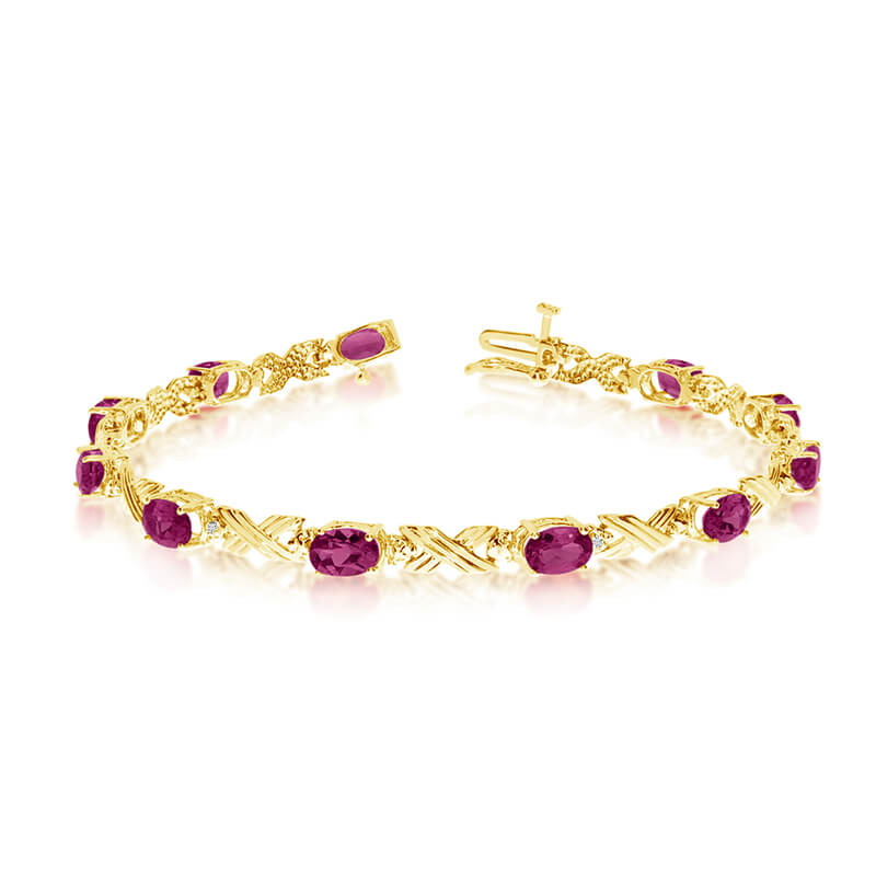 This 14k yellow gold oval ruby and diamond bracelet features eleven 6x4 mm stunning natural ruby ...
