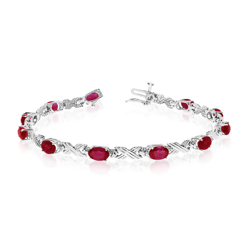 This 14k white gold oval garnet and diamond bracelet features eleven 6x4 mm stunning natural garn...