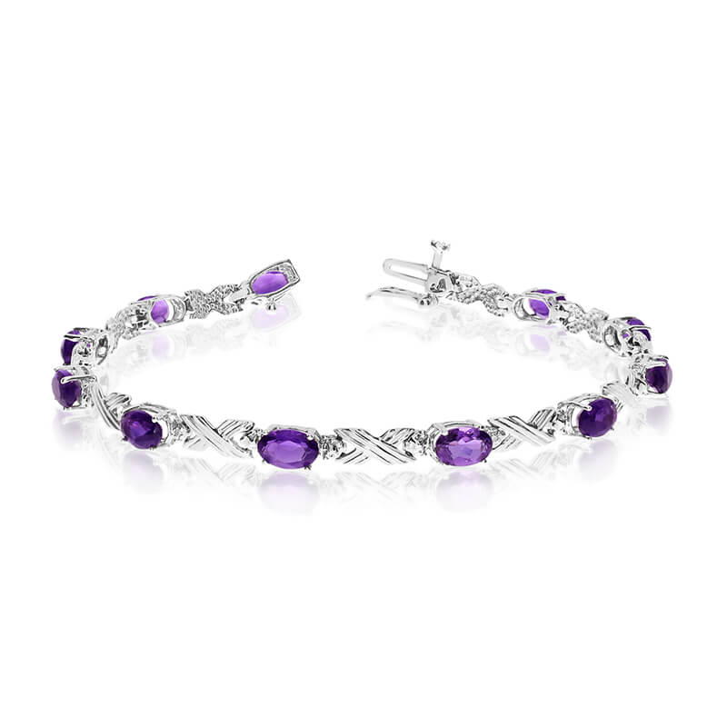 This 14k white gold oval amethyst and diamond bracelet features eleven 6x4 mm stunning natural am...