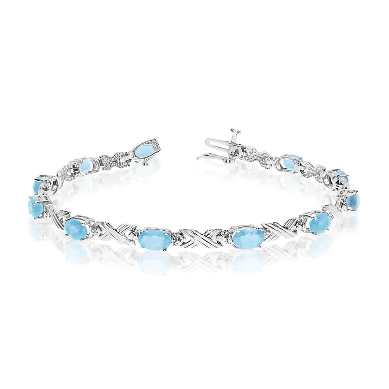 This 14k white gold oval aquamarine and diamond bracelet features eleven 6x4 mm stunning natural ...