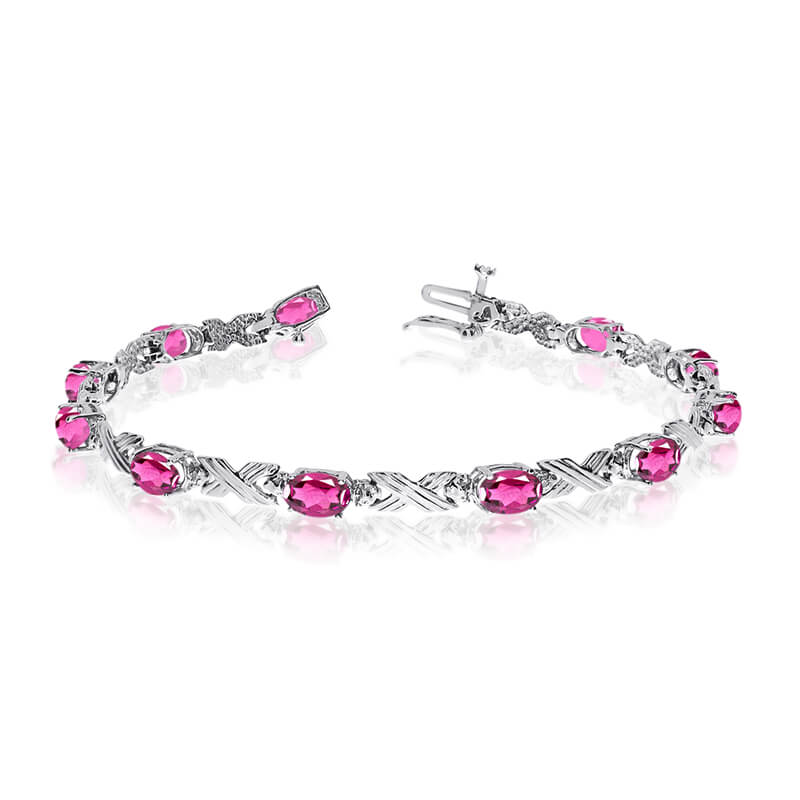 This 14k white gold oval pink topaz and diamond bracelet features eleven 6x4 mm stunning natural ...