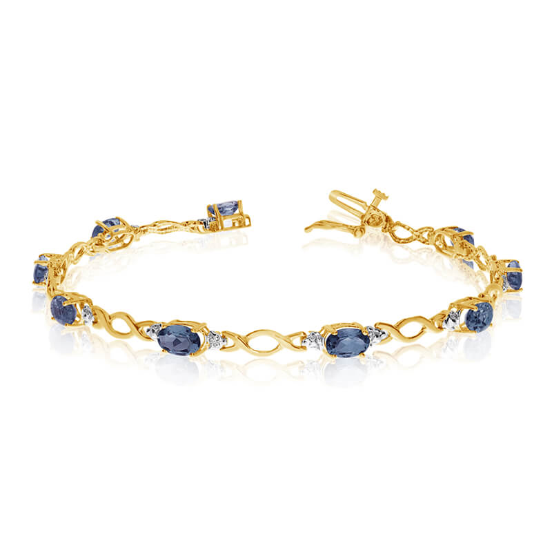 This 10k yellow gold oval sapphire and diamond bracelet features ten 6x4 mm stunning natural sapp...