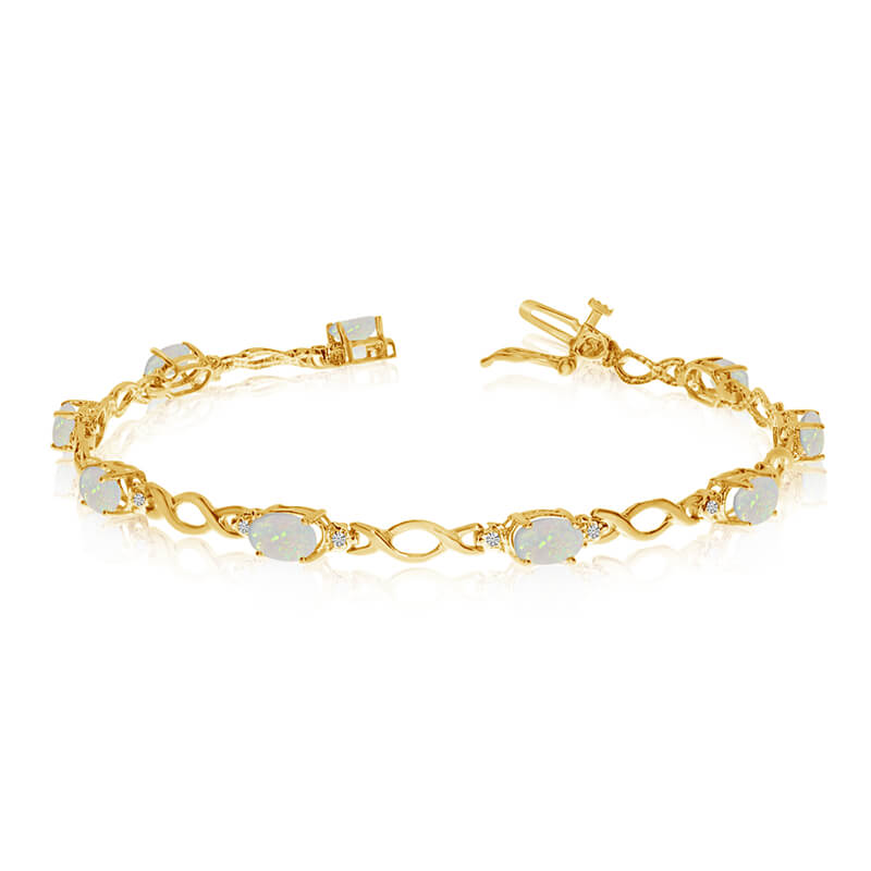 This 10k yellow gold oval opal and diamond bracelet features ten 6x4 mm stunning natural opal sto...