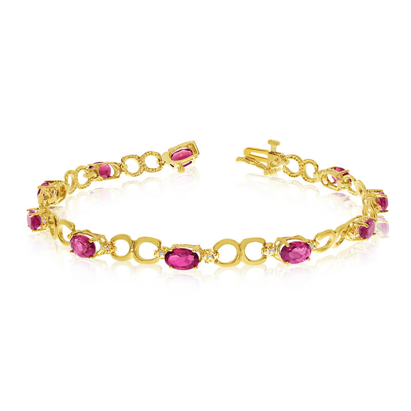 This 10k yellow gold oval ruby and diamond bracelet features ten 6x4 mm stunning natural ruby sto...