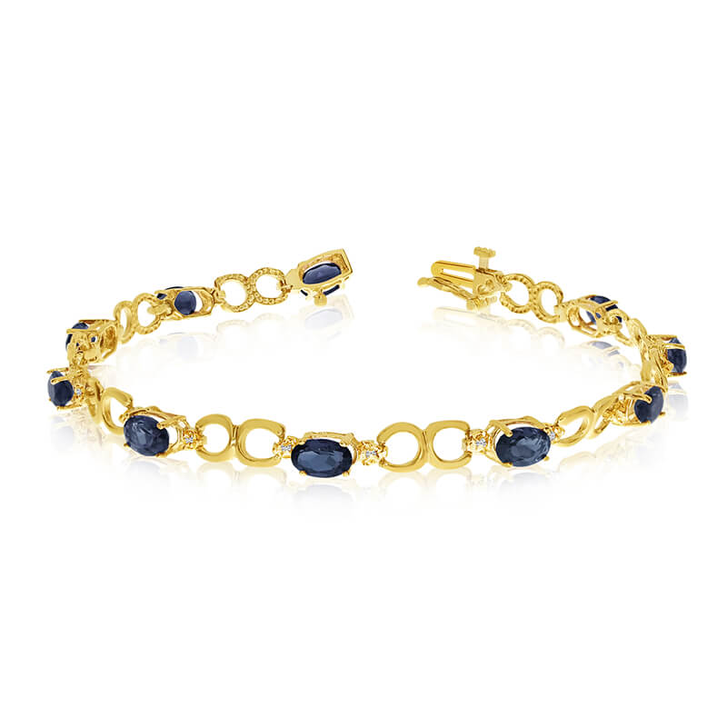 This 10k yellow gold oval sapphire and diamond bracelet features ten 6x4 mm stunning natural sapp...