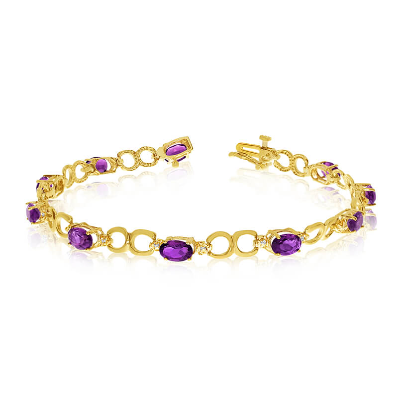 This 14k yellow gold oval amethyst and diamond bracelet features ten 6x4 mm stunning natural amet...