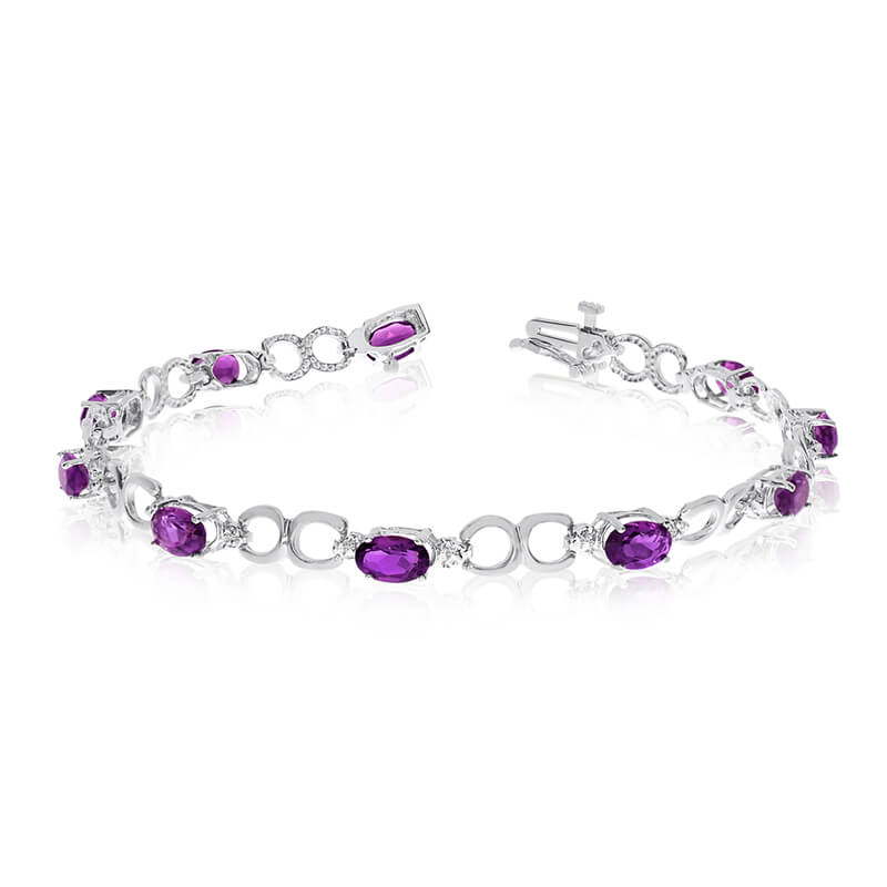 This 14k white gold oval amethyst and diamond bracelet features ten 6x4 mm stunning natural ameth...