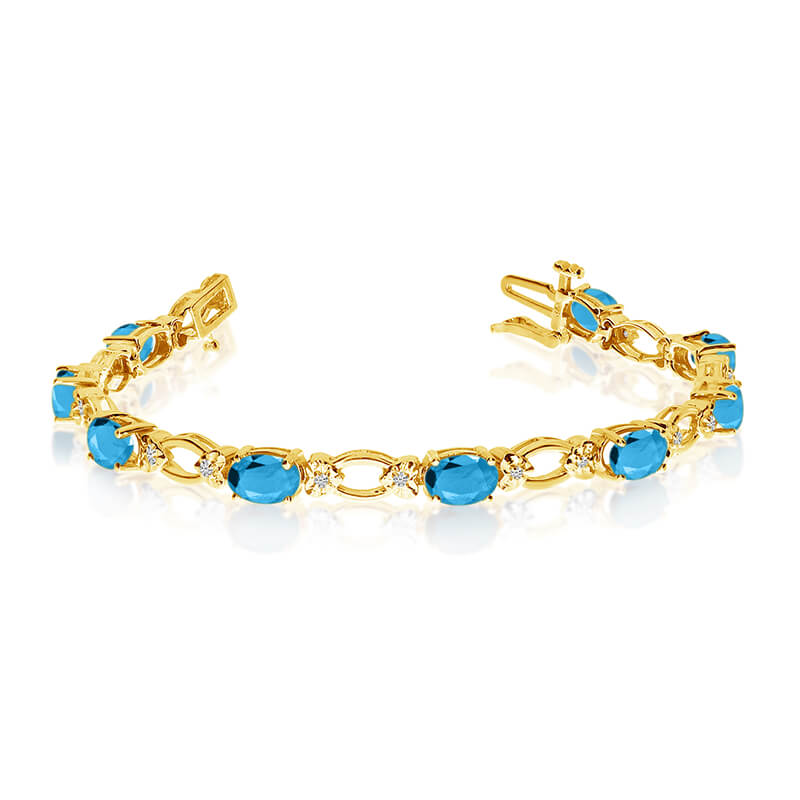 This 14k yellow gold natural blue-topaz and diamond tennis bracelet features 12 oval blue-topazs with a total gem weight of 4.8 carats and a total diamond weight of 0.12 carats.