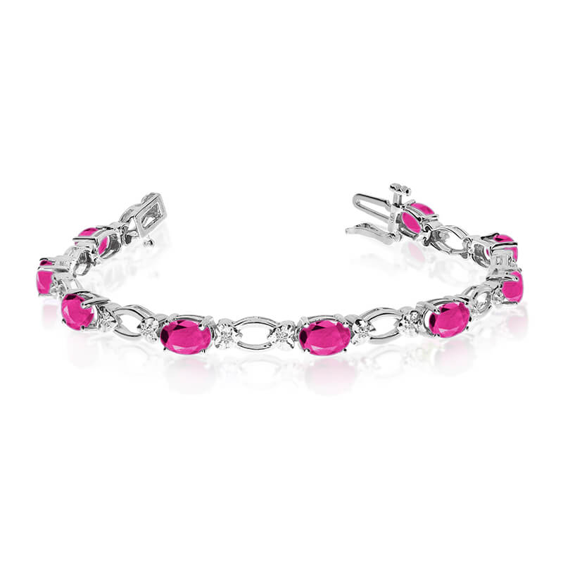 This 14k white gold natural pink-topaz and diamond tennis bracelet features 12 oval pink-topazs w...