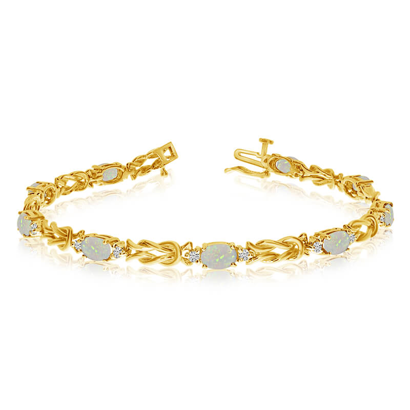 This 14k yellow gold natural opal and diamond tennis bracelet features 9 oval opals with a total ...