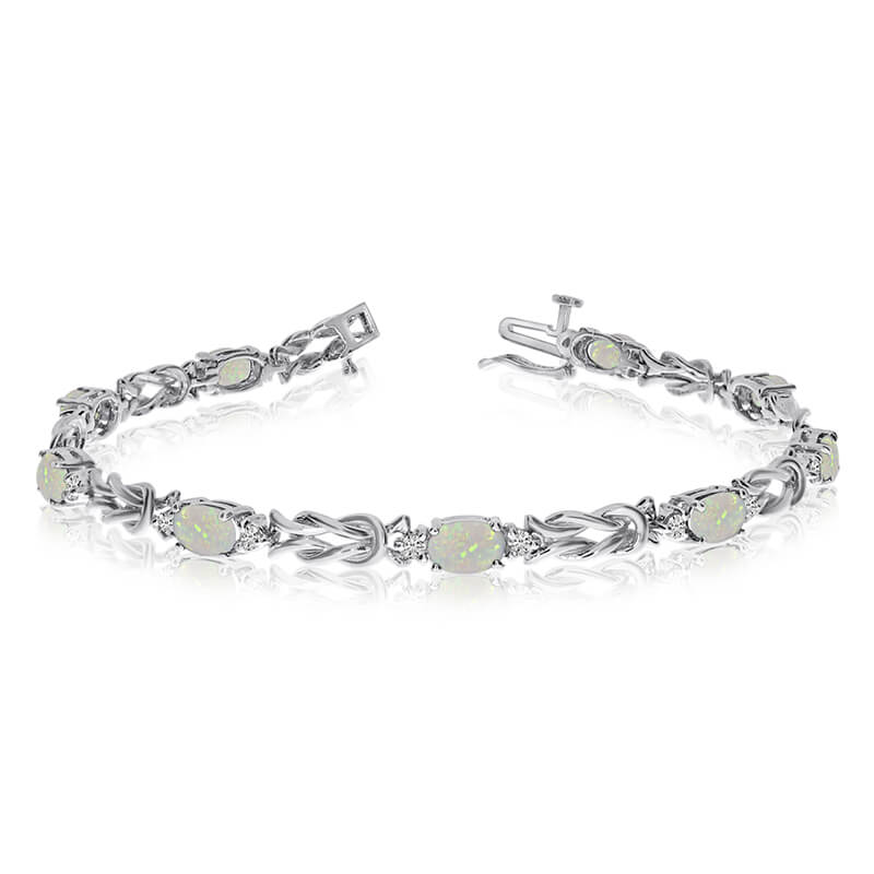This 14k white gold natural opal and diamond tennis bracelet features 9 oval opals with a total g...