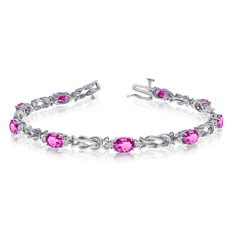 This 14k white gold natural mystic topaz and diamond tennis bracelet features 9 oval all natural mystic topaz. and a total diamond weight of 0.5 carats.