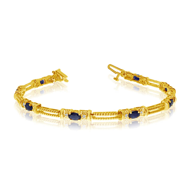 This 14k yellow gold natural sapphire and diamond tennis bracelet features 8 oval sapphires with ...