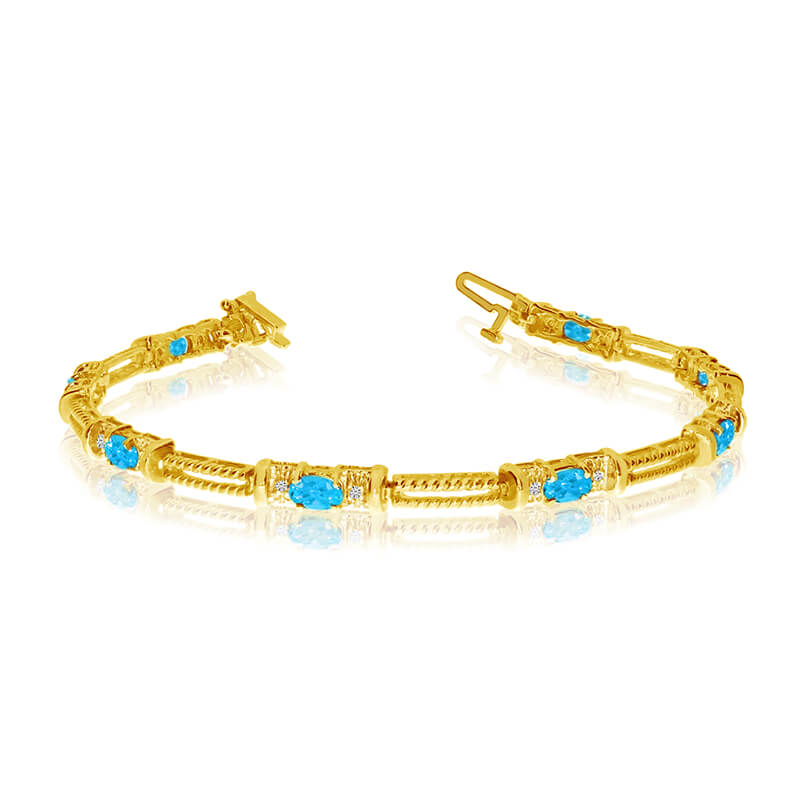 This 14k yellow gold natural blue-topaz and diamond tennis bracelet features 8 oval blue-topazs w...