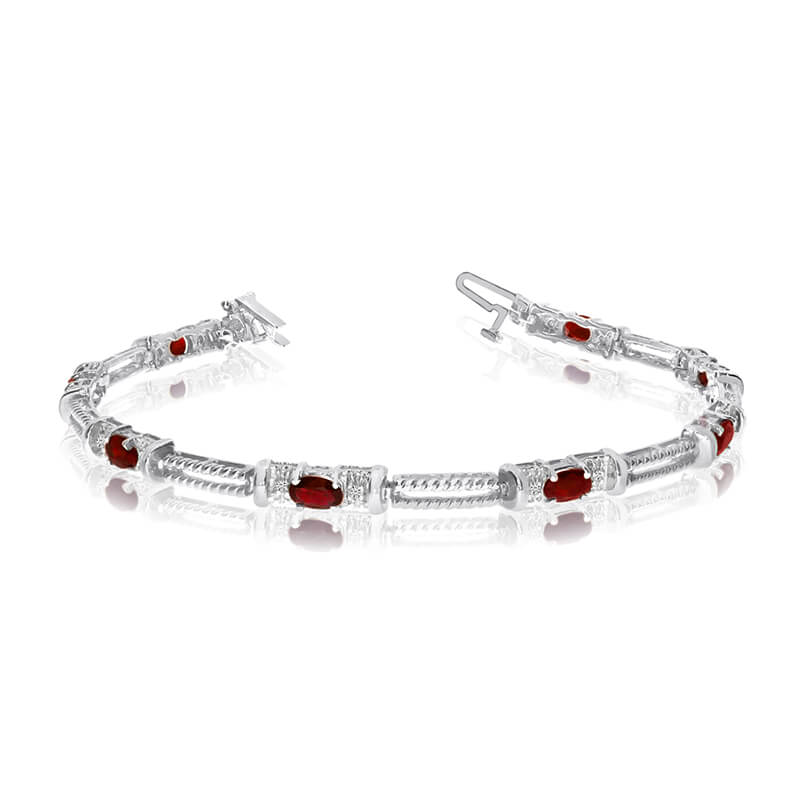 This 14k white gold natural garnet and diamond tennis bracelet features 8 oval garnets with a tot...
