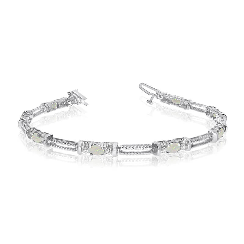 This 14k white gold natural opal and diamond tennis bracelet features 8 oval opals with a total gem weight of 0.64 carats and a total diamond weight of 0.16 carats.