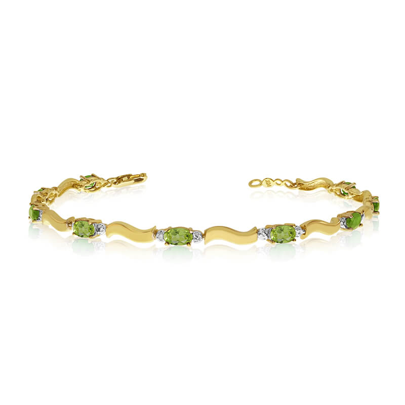 This 10K Yellow Gold oval peridot and diamond bracelet features nine 5x3 mm stunning natural peri...